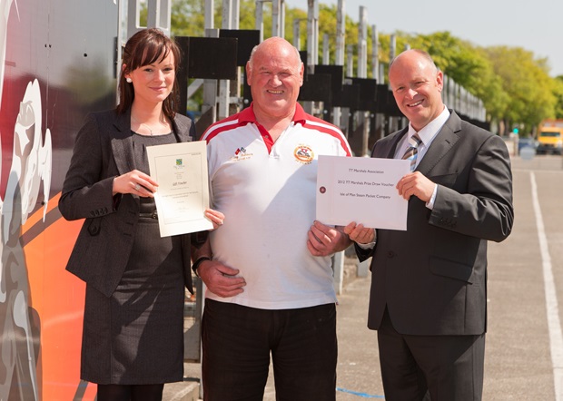 Sefton Group Marketing Manager Naomi Finch and Steam Packet Company Chief Executive Mark Woodward (right) present the competition prizes to Terry Holmes, Chairman of the TT Marshals’ Association